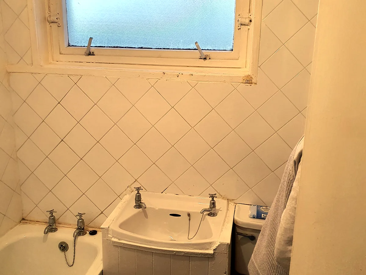 Compact bathroom before renovation