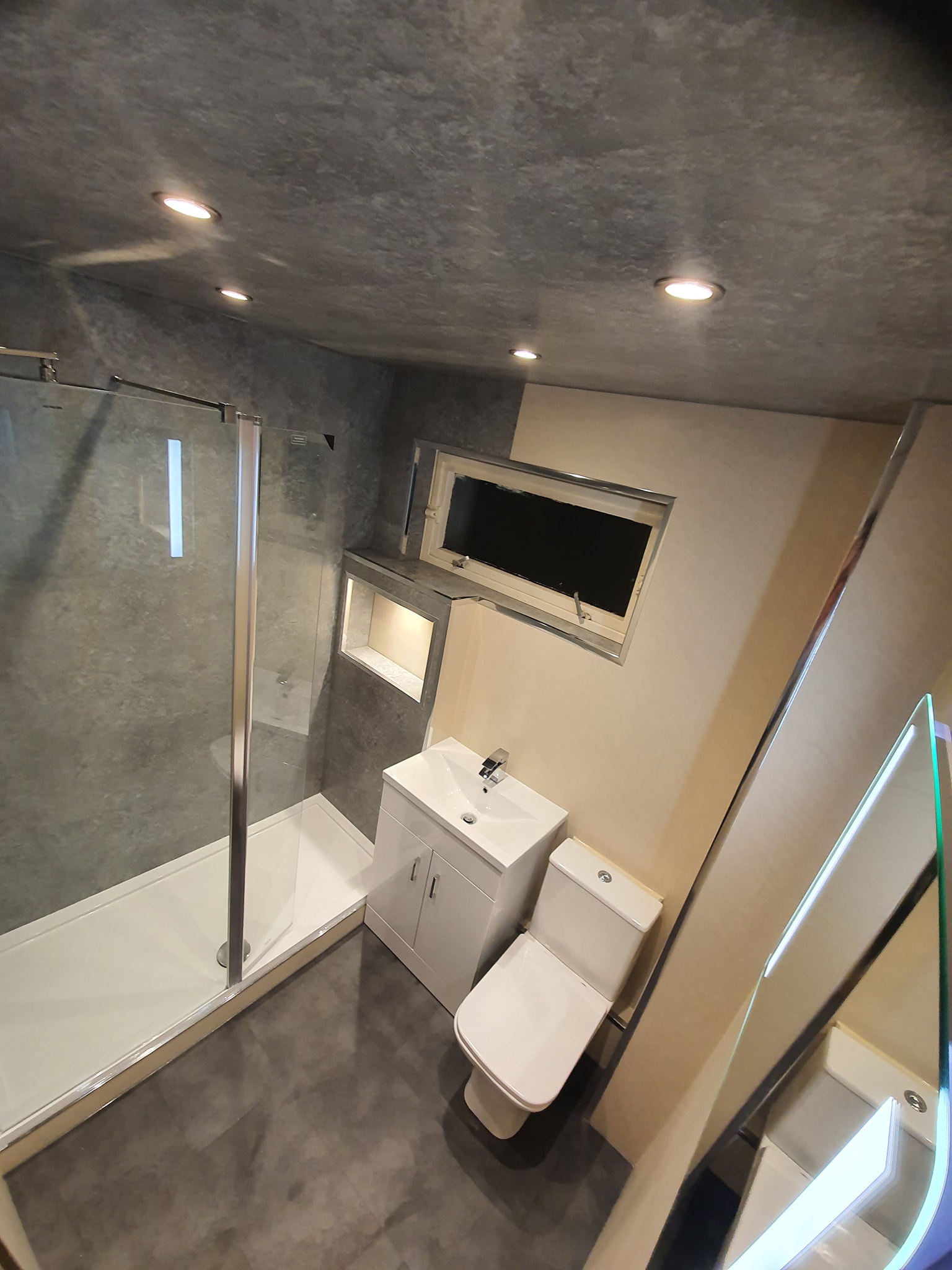 Completed bathroom installation with plumbing and finishing work